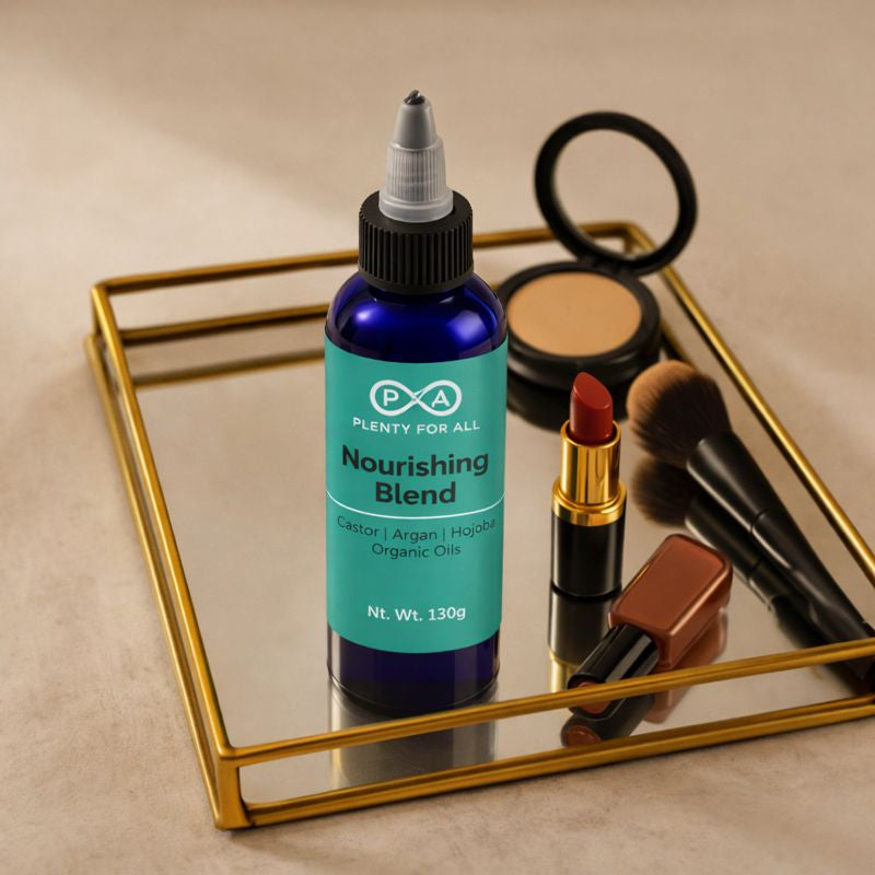 Bottle of PlentyForAll 'Nourishing Blend' on a decorative tray with makeup items